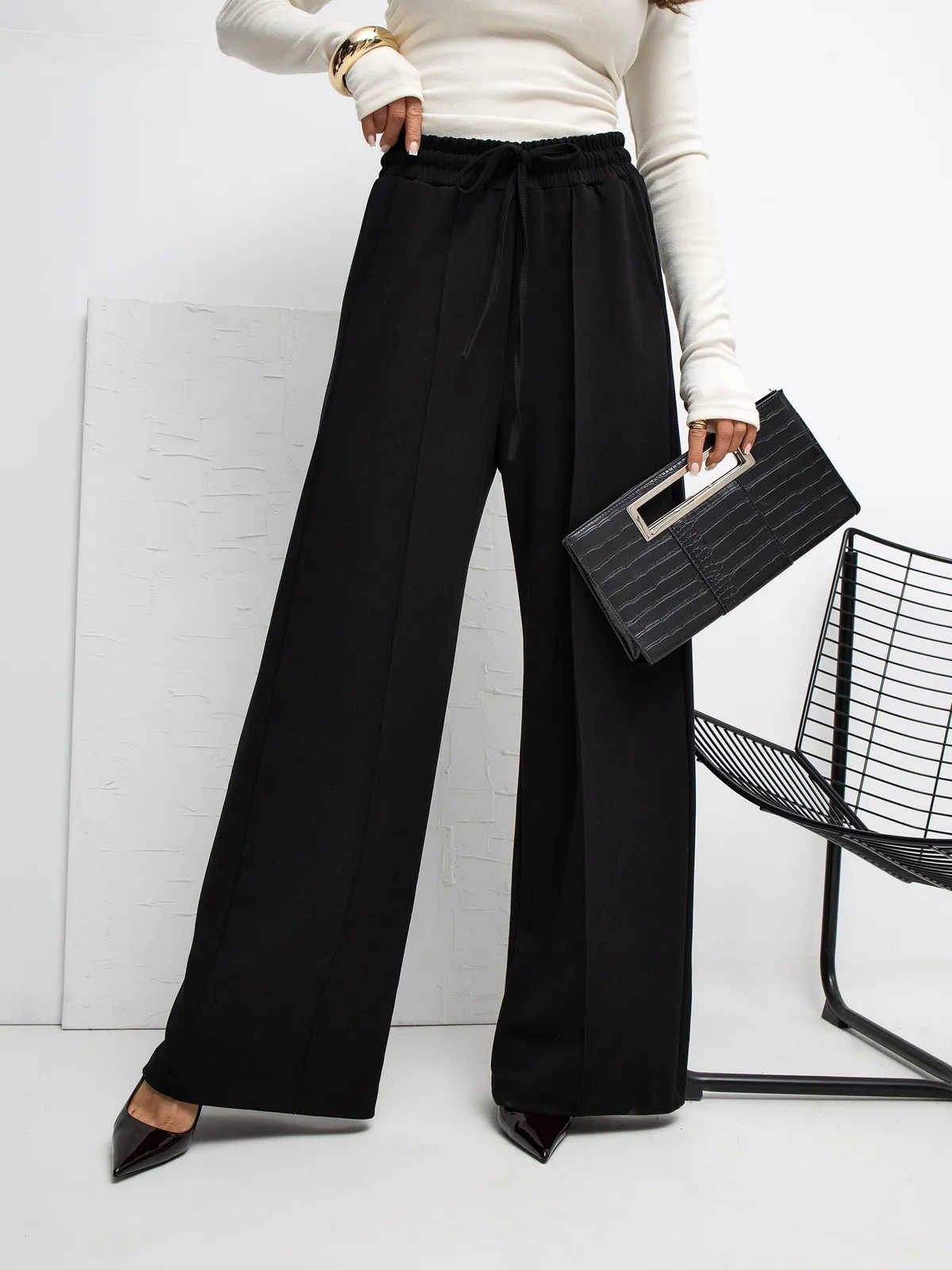 Eleganckie spodnie z szerokimi nogawkami i wiązaniem - zdjęcie 1