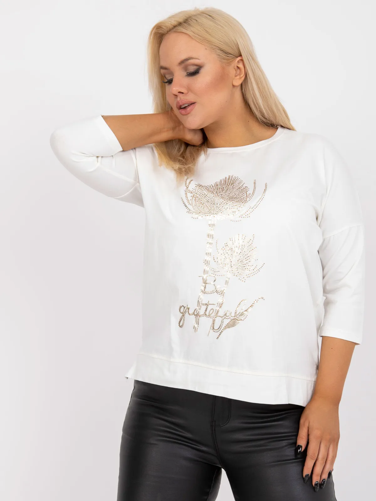 Bluzka o kroju oversize z ozdobnym nadrukiem - zdjęcie 1