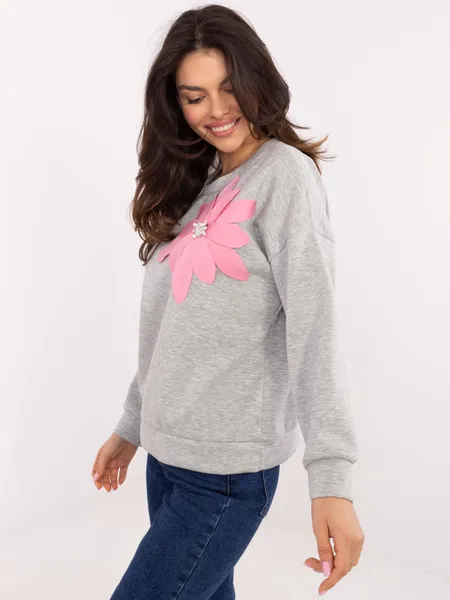 Bluza oversize z ozdobnym kwiatowym detalem