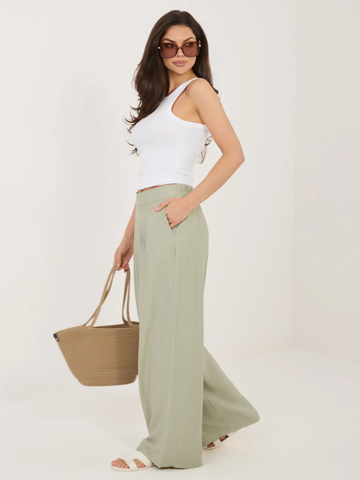 Szerokie spodnie z zakładkami o kroju palazzo - zdjęcie 1