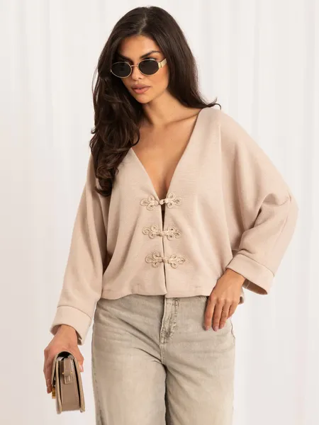 Krótki kardigan oversize z ozdobnymi zapięciami