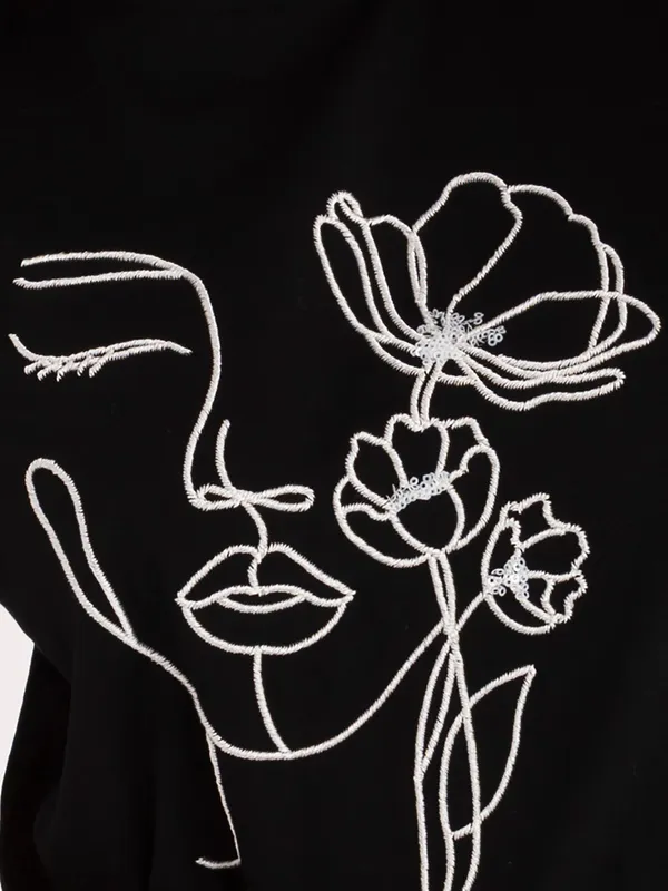 T-shirt z grafiką twarzy i kwiatów