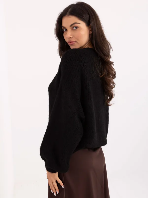 Sweter oversize o luźnym kroju z warkoczem