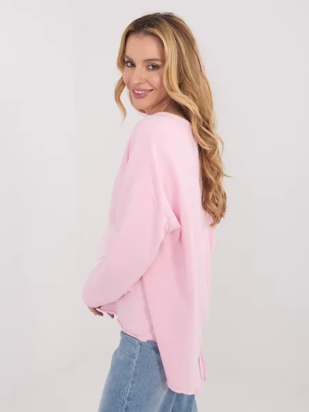Bluzka oversize z ozdobnym kwiatowym detalem