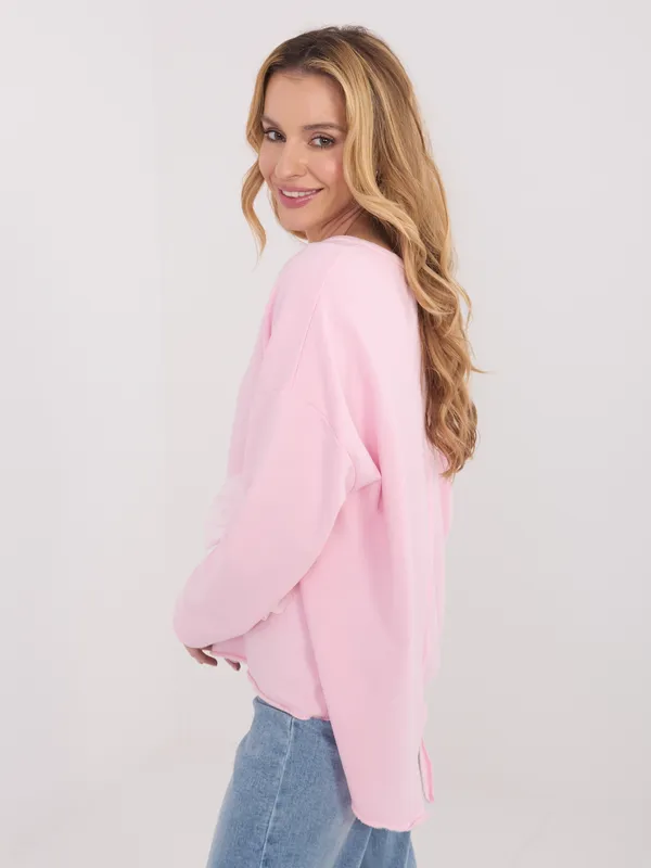 Bluzka oversize z ozdobnym kwiatowym detalem