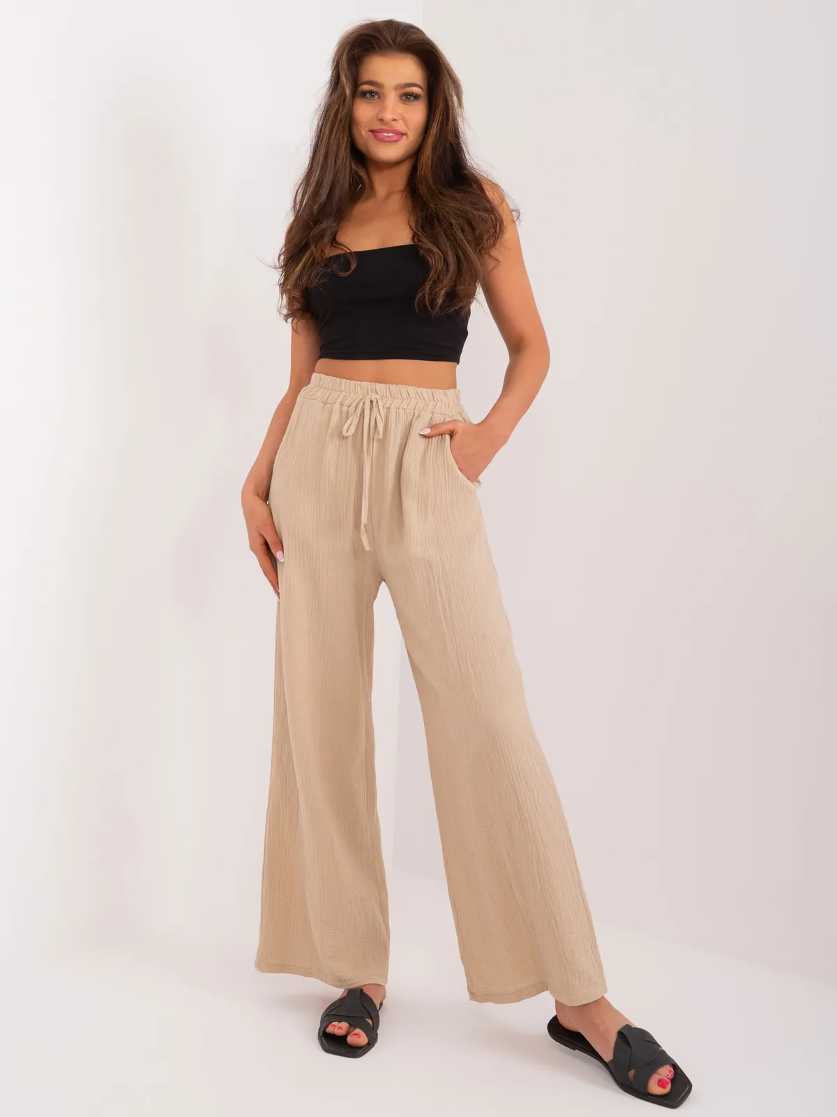 Luźne spodnie z wysokim stanem i wiązaniem - zdjęcie 1