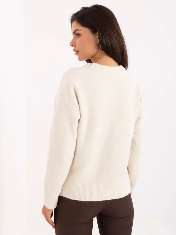 Casualowy sweter oversize z ozdobną aplikacją misia