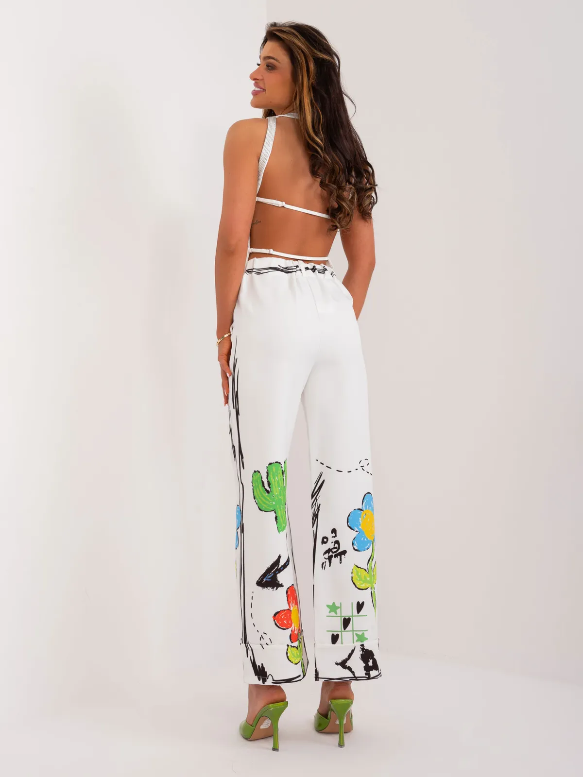 Spodnie o kroju palazzo z artystycznym nadrukiem - zdjęcie 1
