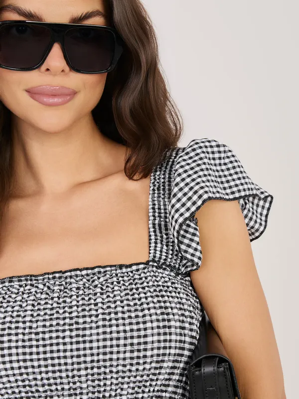 Zwiewna sukienka midi z odkrytymi ramionami