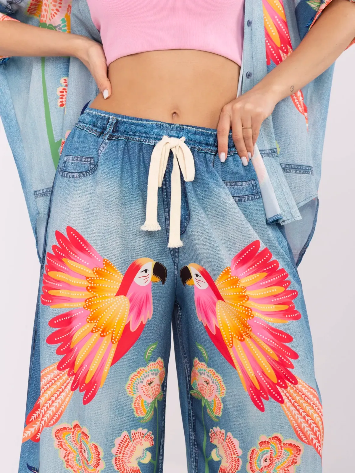 Szerokie spodnie z wiązaniem i egzotycznym printem - zdjęcie 1